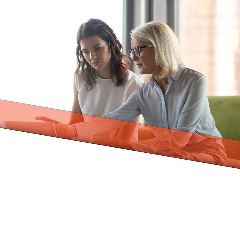 loutel law home slide 02 mobile A female attorney meeting with her client to discuss information.